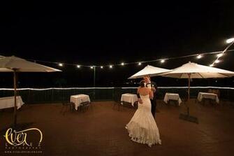 Couple Enjoying A Moment At The Golf Club Deck Oakmont