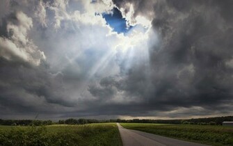 Sunlight Through Storm Clouds Wallpaper