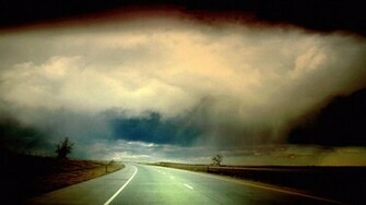 Storm Clouds Over Empty Road Wallpaper