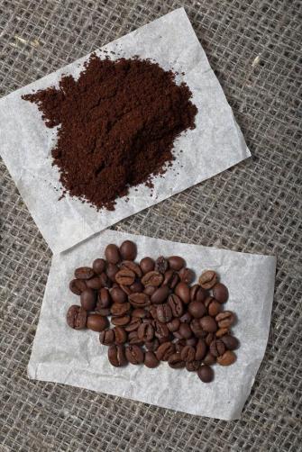 Ground Coffee And Grains On A Background Of Coarse Linen