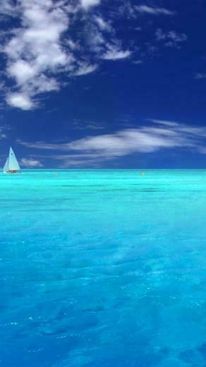 Light Blue Ocean And Sailboat iPhone Wallpaper