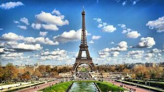 Eiffel Tower On Background Of Clouds In Paris France Wallpaper And