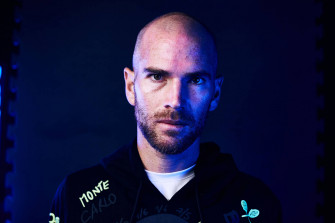 A Bald Man In Hoodie With Neon Lights Wallpaper