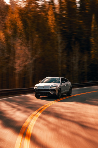 Black Sedan On Road During Daytime Photo Background Image