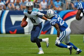 Tennessee Titans Quarterback Marcus Mariota Scrambles To Avoid