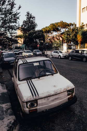 White Car Parked On The Side Of Road Photo Napoli Image