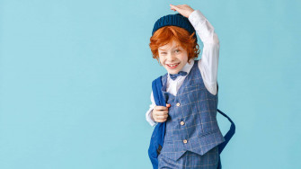 Stylish Boy In School Outfit Wallpaper