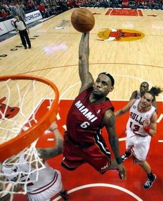 Miami Heat Forward Lebron James Dunks Against The Chicago Bulls During
