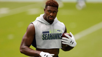 Seattle Seahawks Star Dk Metcalf In Casual White Attire Wallpaper