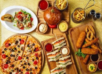 A Pizza Fries And Other Food On Wooden Table Wallpaper