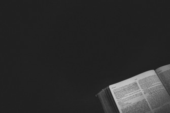 Open Bible On A Black Wallpaper