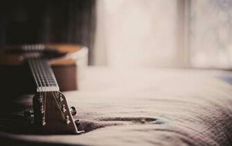 Guitar On The Bed Wallpaper