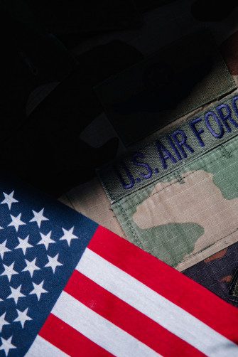 A Close Up Of Us Army Uniform And An American Flag Photo
