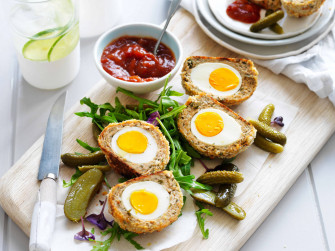 Traditional British Scotch Eggs Dish With Pickles And Wallpaper