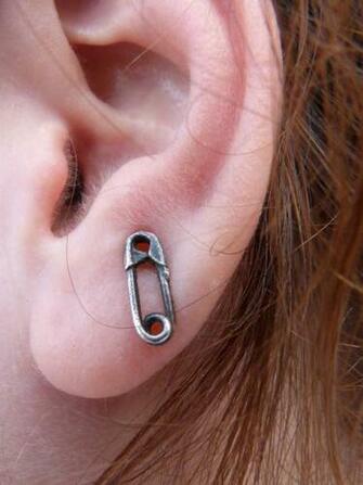 Person Holding The Left Ear Of A Girl Image