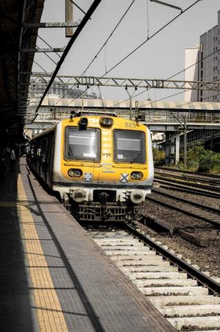 Yellow And Black Train On Rail Tracks During Daytime Photo
