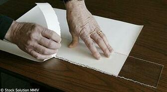 The Ripper Is Placed Over Paper And Edge Of