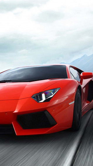Bold Red Car In The Modern Landscape Wallpaper
