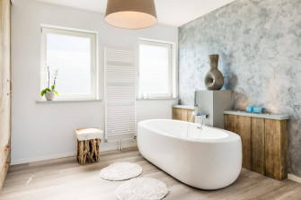 Luxurious White Oblong Bathtub In A Serene Setting Wallpaper