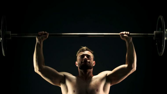 Young Sportsman Lifting Heavy Barbell Hard Training Of