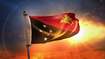 Papua New Guinea Flag Backlit At Beautiful Sunrise Loop Slow