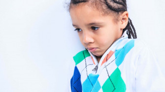 Serene Portrait Of A Young Boy In Natural Setting