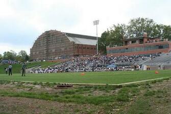 Action At The Butler Bowl With Hinkle Fieldhouse In Background
