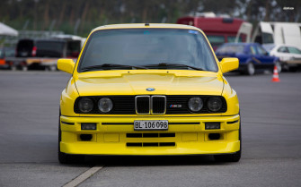 Stunning Yellow Bmw M Series In Action Wallpaper
