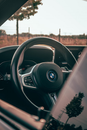 The Interior Of A Car With Steering Wheel And Dashboard Photo