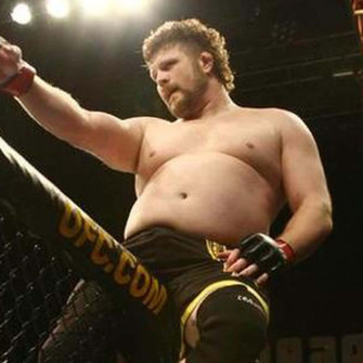 Roy Nelson Triumphantly Celebrating His Mma Victory Wallpaper
