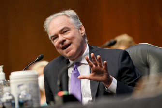 Tim Kaine Passionately Speaking Into Microphone Wallpaper