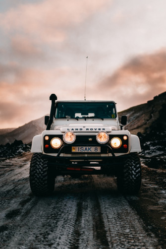 Grayscale Photo Of Black Jeep Wrangler On Rocky Hill