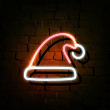 Premium Vector Of Santa Hat Neon Sign On A Dark Brick