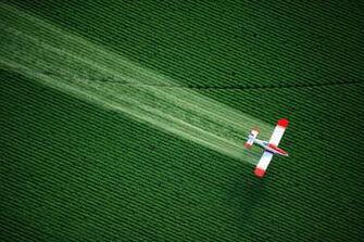 Plane Spraying Over Crop 4k Wallpaper