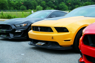 Parked Yellow Ford Mustang Coupe And Black Photo Car Image