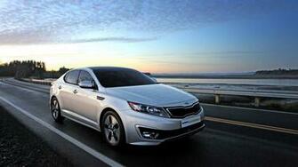Kia Optima Hybrid Running On Highway Wallpaper