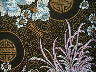 Black Background With Woven Metallic Gold Asian Pattern Featuring