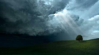 Sunlight Through Dark Clouds Wallpaper
