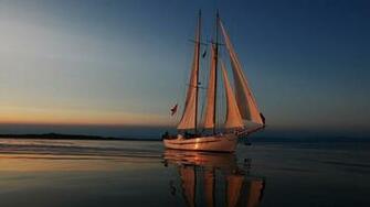 Yacht Sailing Away From The Sunset