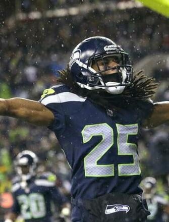 Marshawn Lynch Celebrating Wallpaper For iPhone 3g