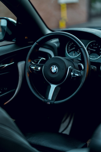 A Close Up Of Steering Wheel And Dashboard Car Photo