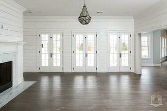 White Shiplap Living Room With Gray Beaded Chandelier Transitional