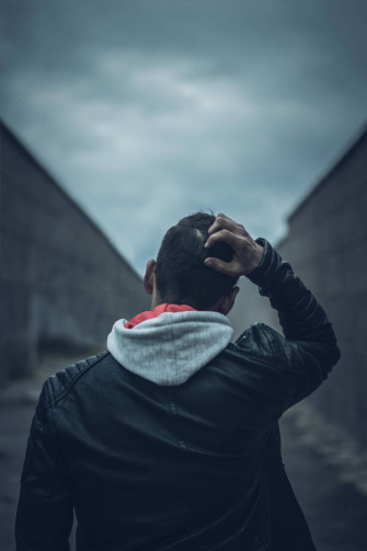 Desolate Emotions A Solemn Young Boy Against Vast