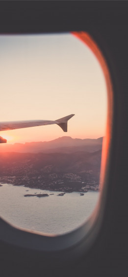 Person Riding Airplane Photography iPhone Wallpaper