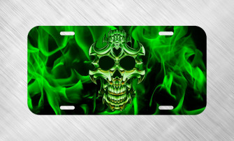 A Green Skull With Flames On Black Wallpaper