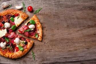 Pizza With Mushrooms Olives And Meat On A Wooden Board HD