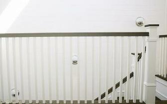 Shiplap Staircase Wall With Staggered Lighting