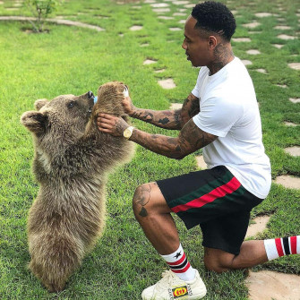 Nathaniel Clyne Playing With Bear Wallpaper