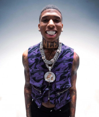 Nle Choppa Striking A Bold Pose Wallpaper