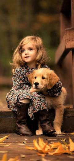 Little Girl With Golden Retriever Puppy Wallpaper